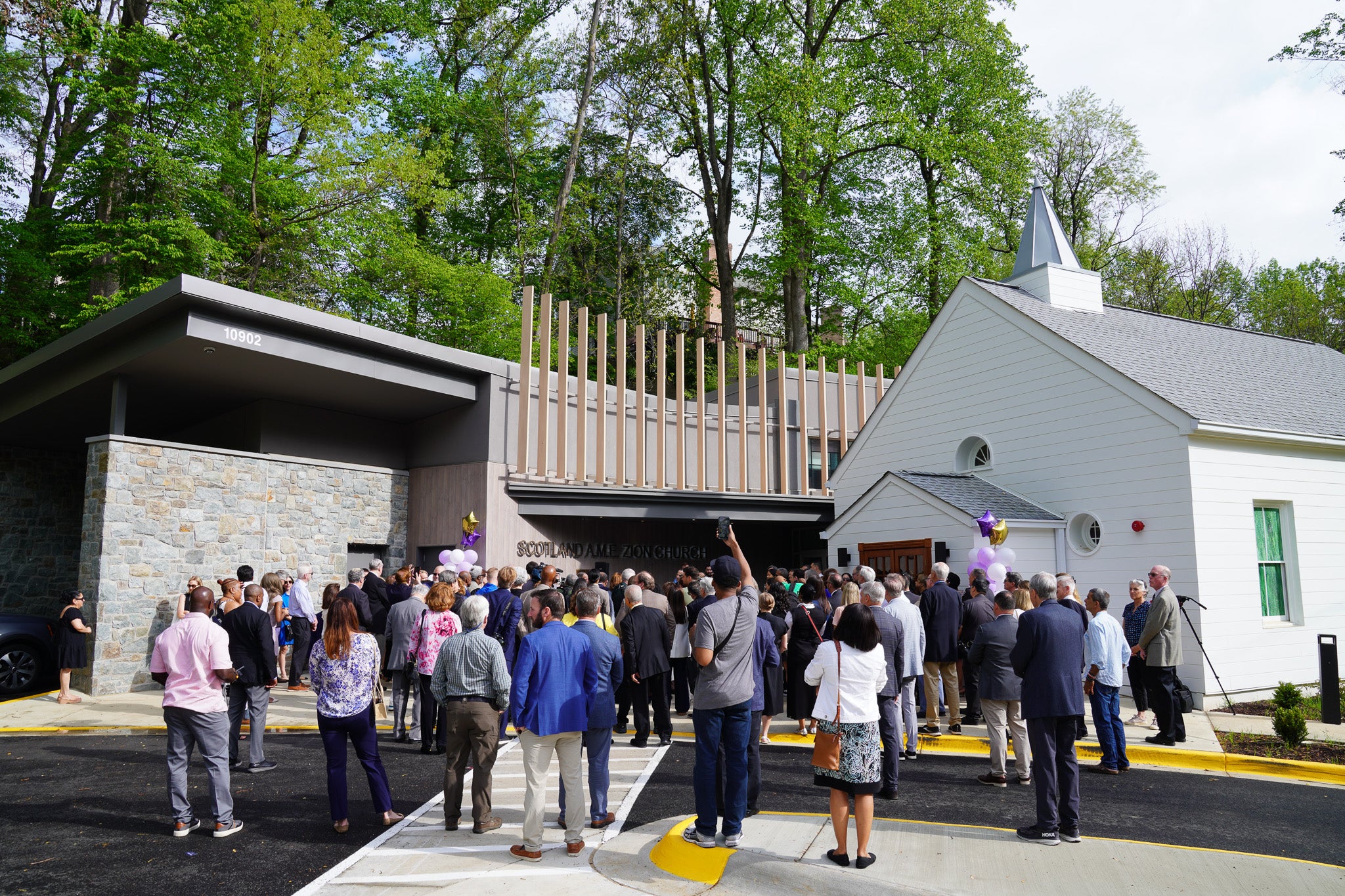 A crowd gathers outside a church