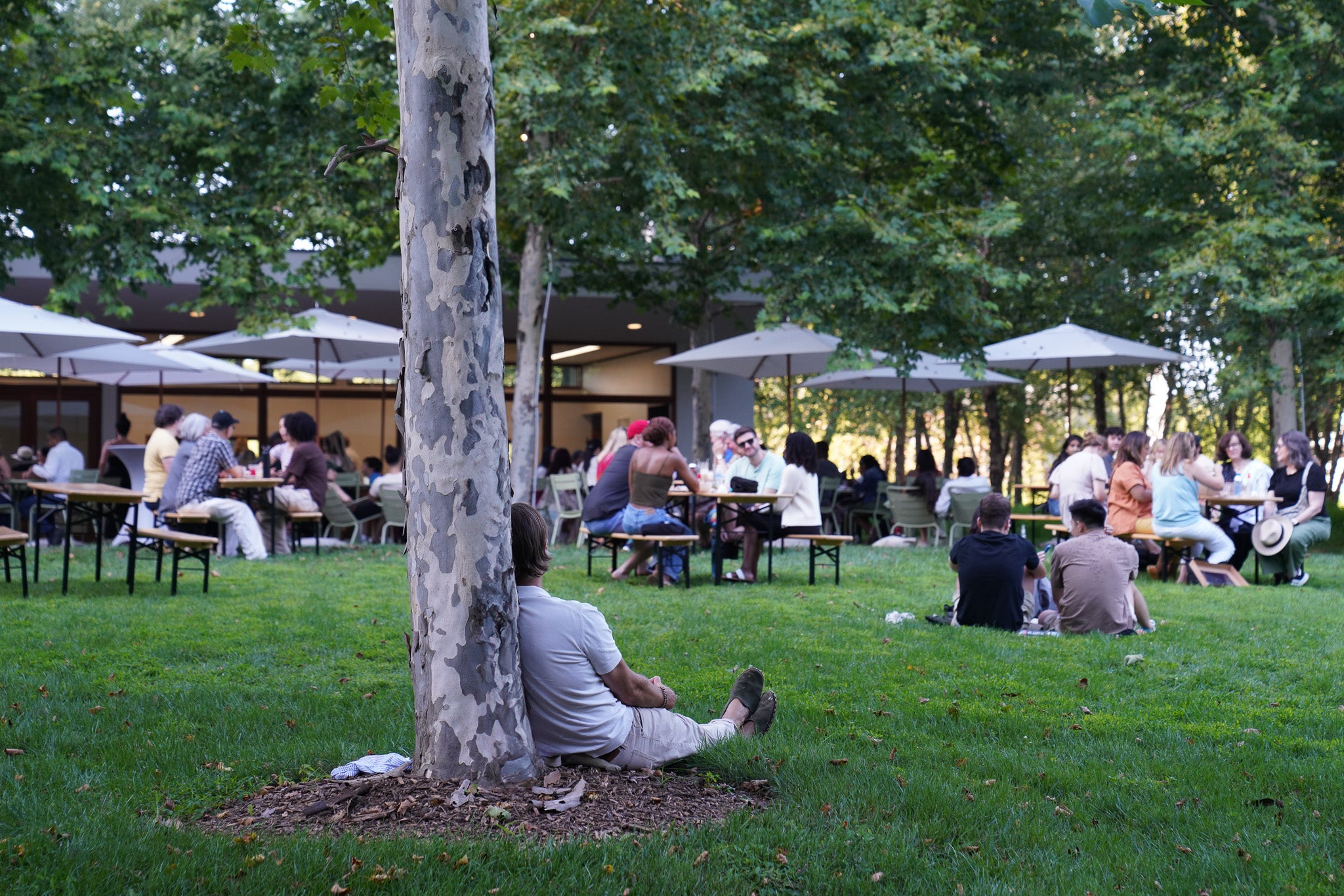 A man sits enjoying summer music