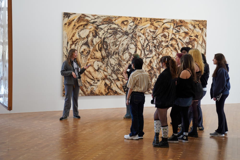 A group of Glenstone dent visitors engage with a Guide
