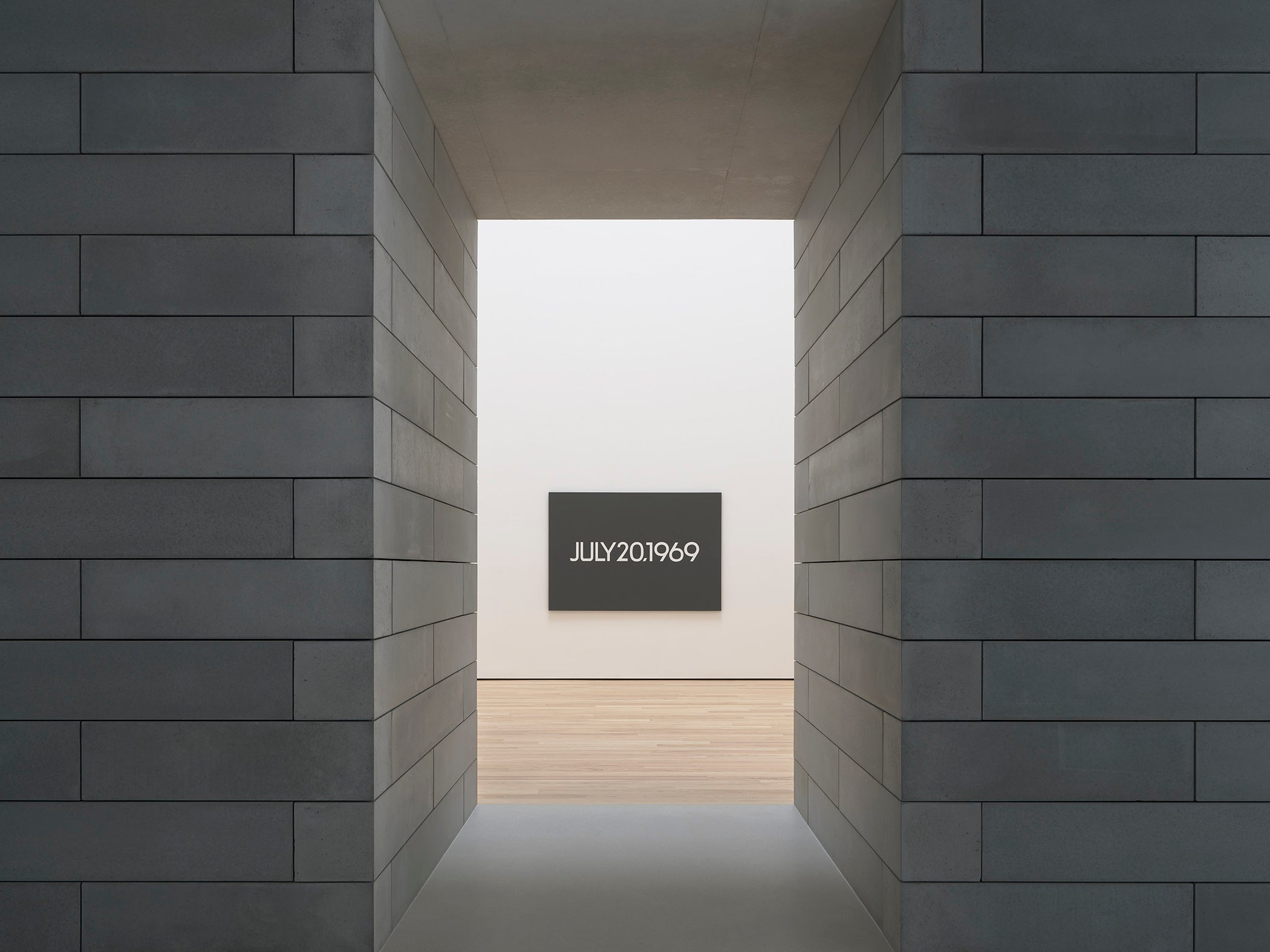 Painting seen through a doorway made of concrete blocks