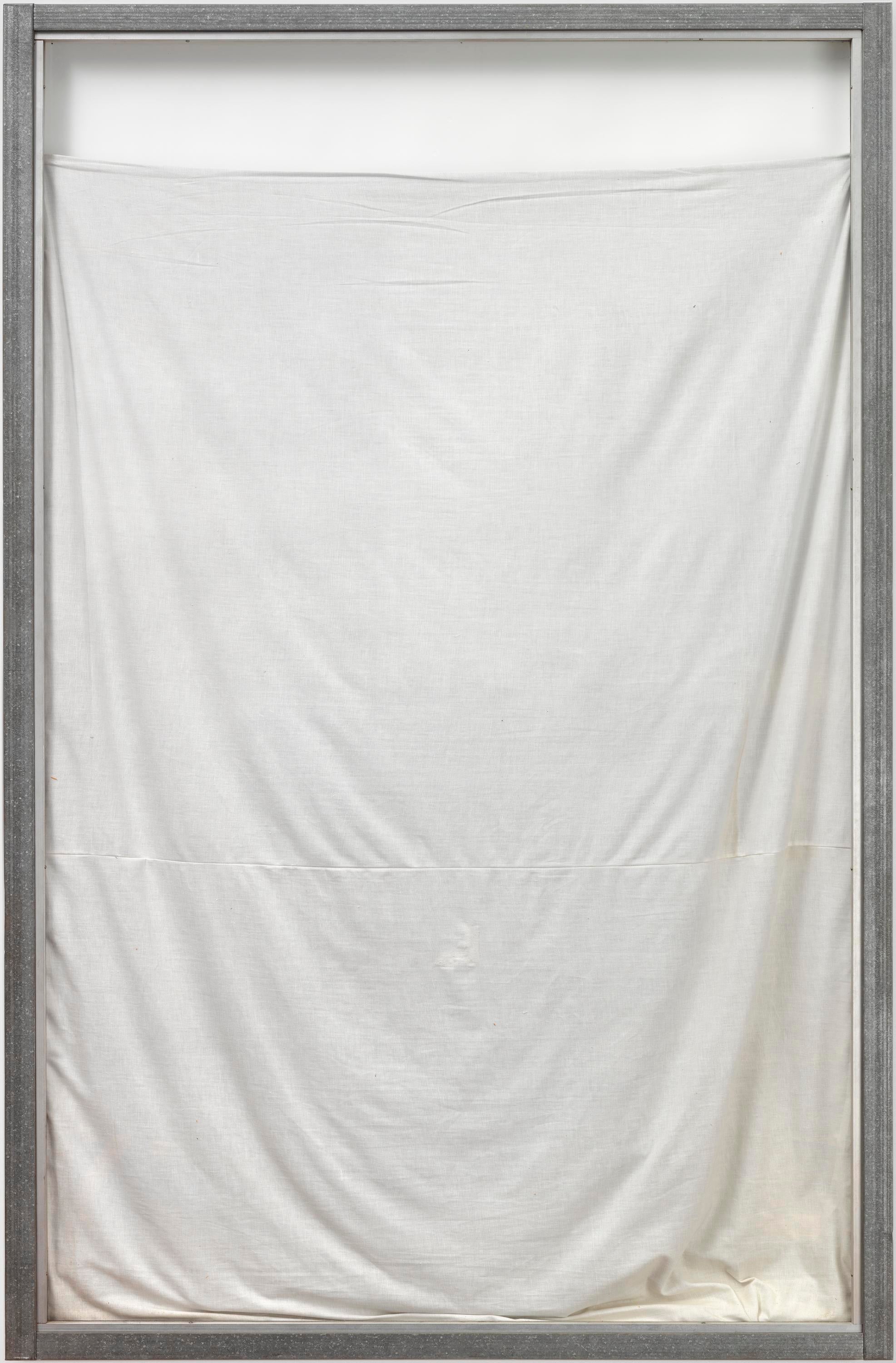 Slightly sagging white fabric hangs a few inches from the top of a silver-colored frame.
