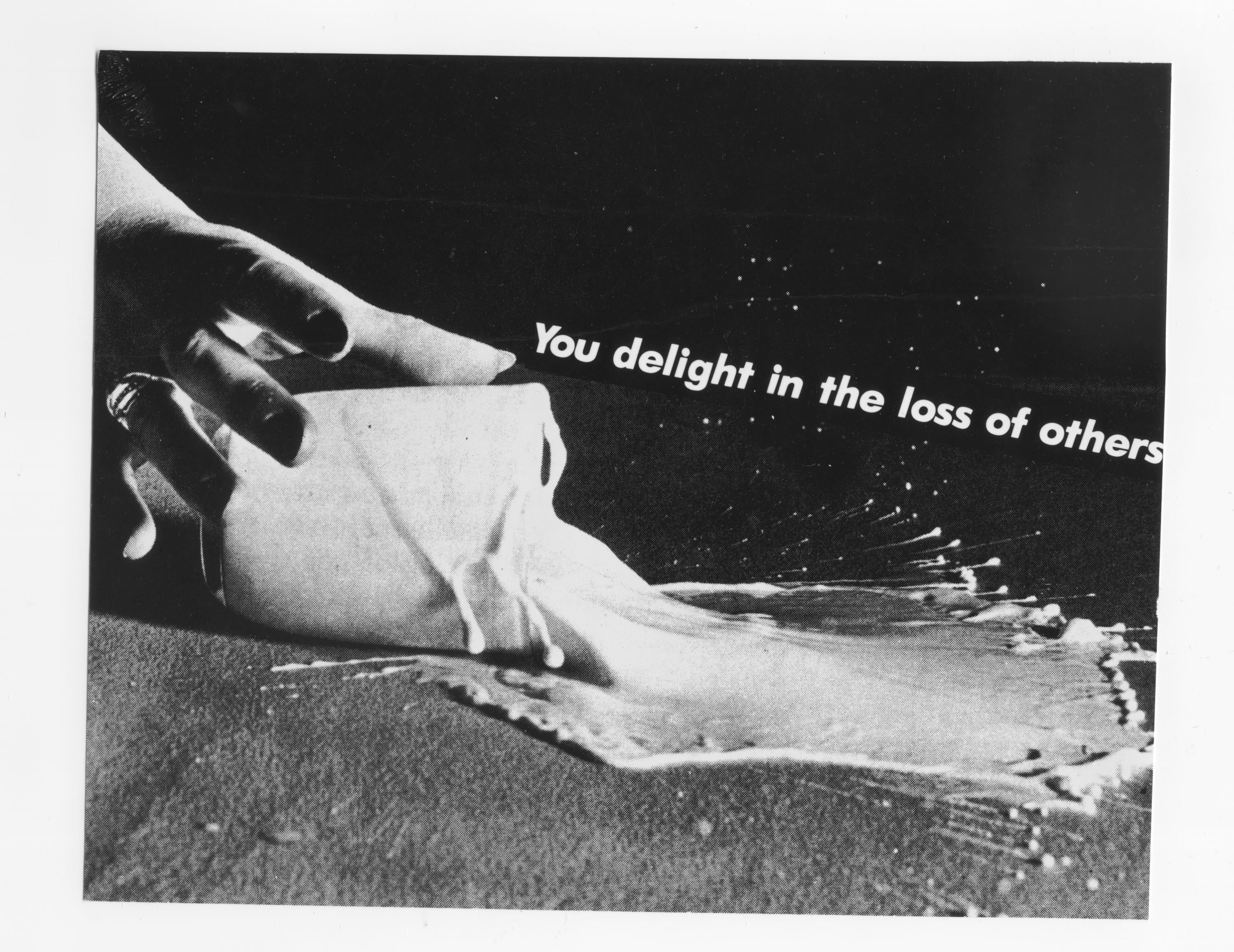 Black and white photo of hand reaching for spilled glass of milk with white text reading You delight in the loss of others.