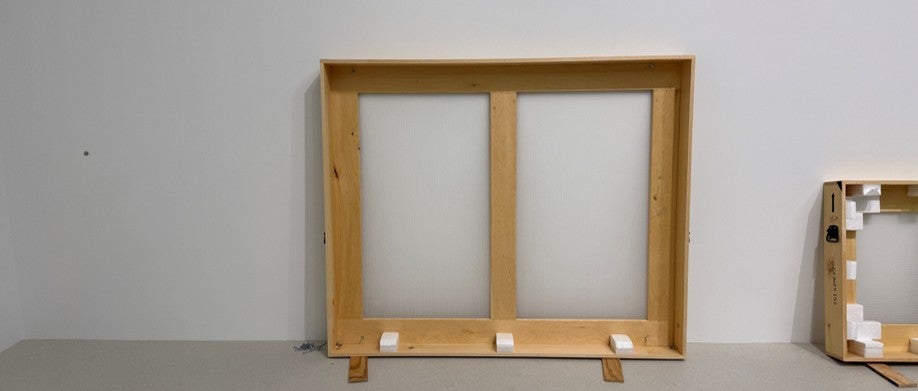 A crate sits in an empty room